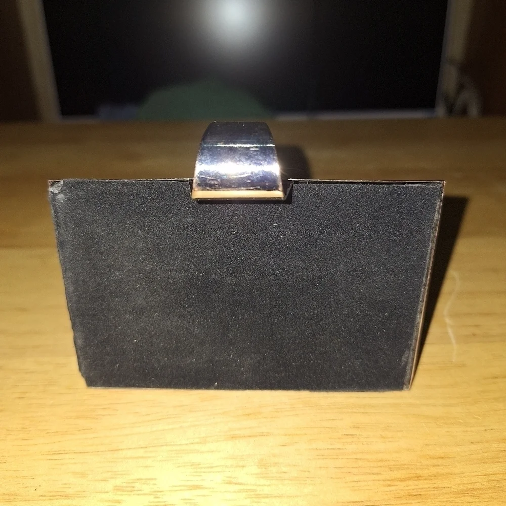 An unbranded Penguin Stocking Holder    It's base is 4